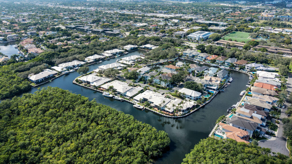 Aerial view of Boca Marina Yacht Club community layout with canals and preserve areas in East Boca Raton