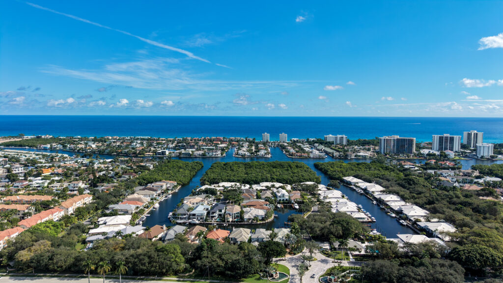 Aerial view of Boca Marina Yacht Club near the Intracoastal Waterway with the Atlantic Ocean in the background