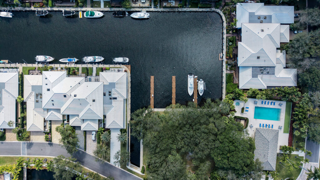 Private docks and boats on the canal at Boca Marina Yacht Club in East Boca Raton