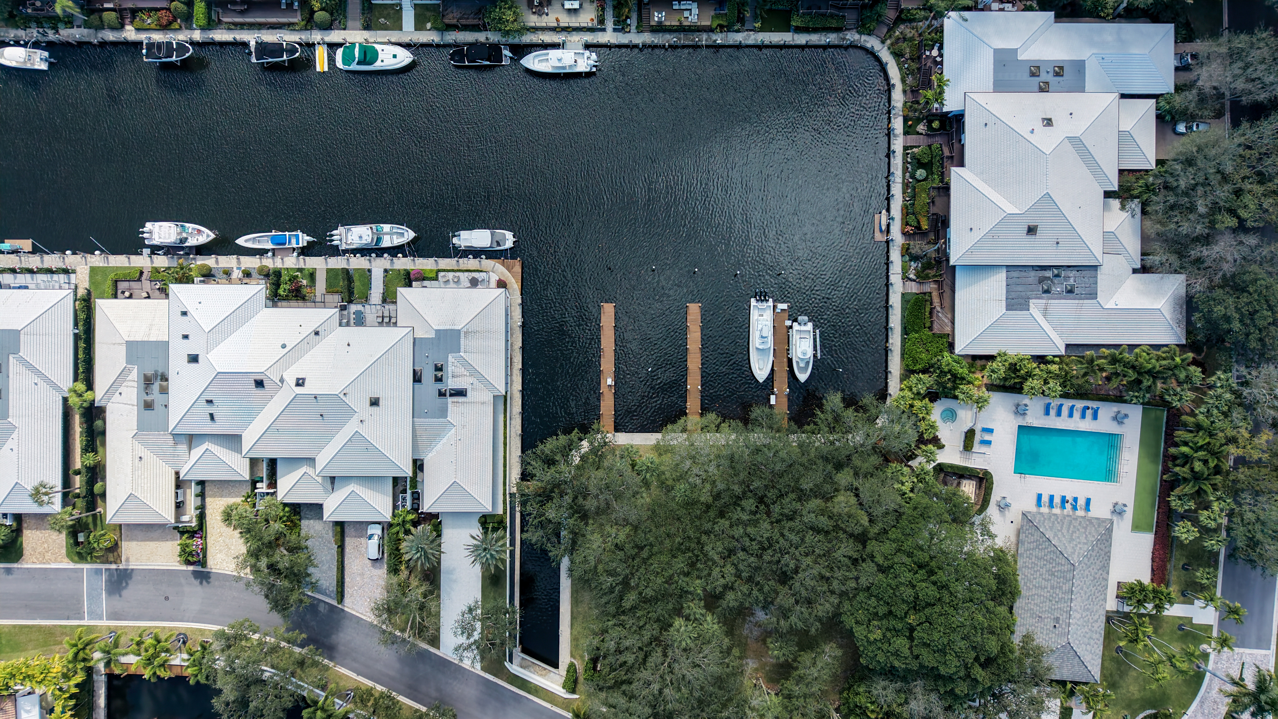 Private docks and boats along protected interior waterways at Boca Marina Yacht Club