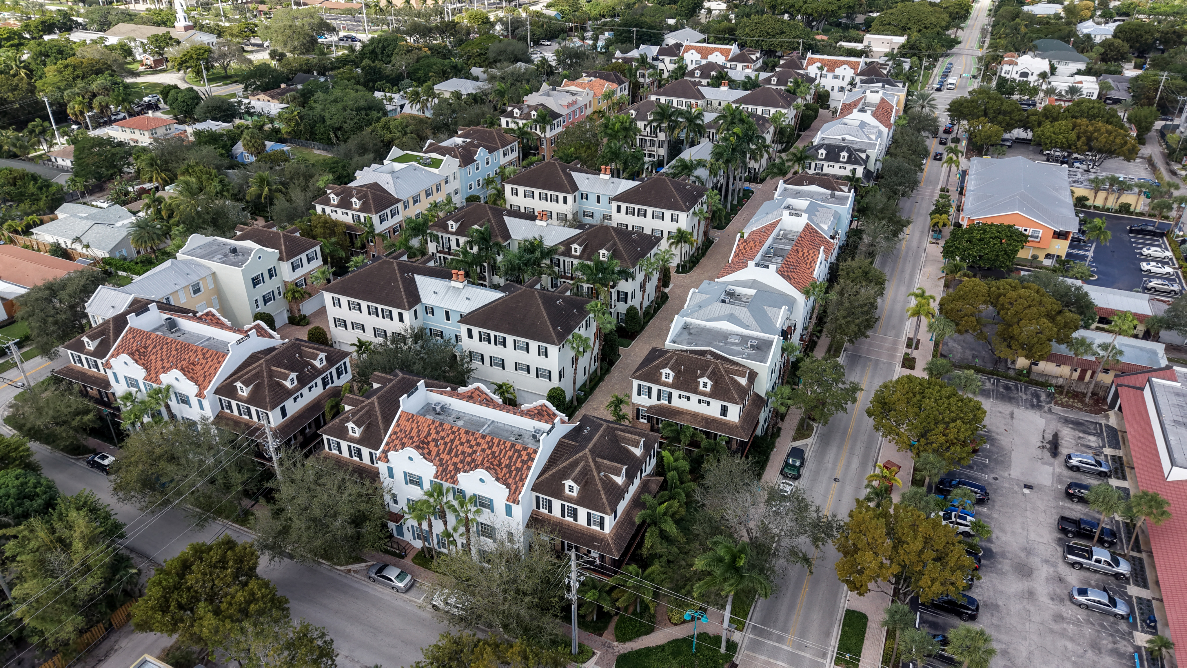 Cannery Row townhomes along a tree-lined street in Pineapple Grove Delray Beach
