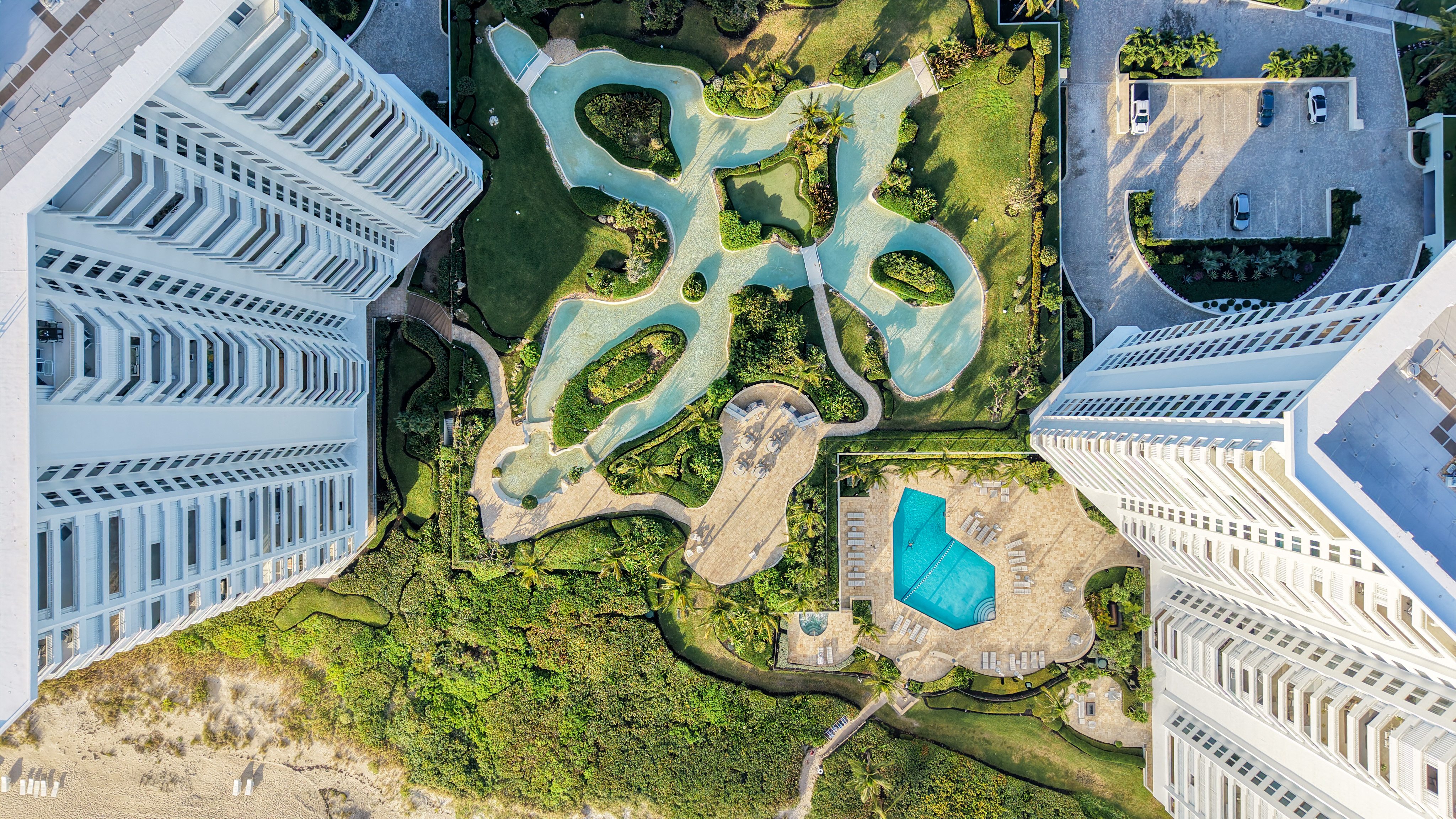 Aerial view of Chalfonte’s lagoon-style pool and landscaped grounds