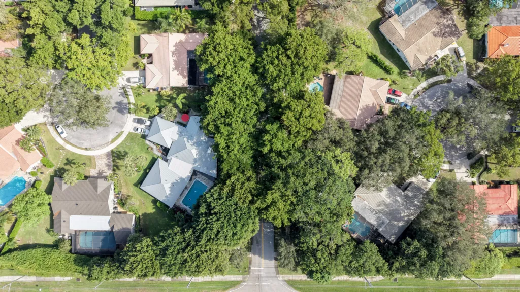 Aerial view of Millpond neighborhood with dense tree coverage in Boca Raton