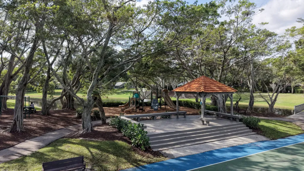 Park pavilion and playground near the tennis courts in the Millpond neighborhood of Boca Raton