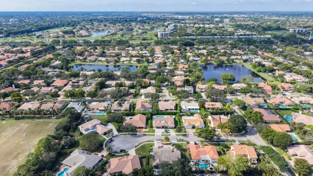 Aerial view of the New Floresta neighborhood in Boca Raton showing lakes and surrounding residential areas