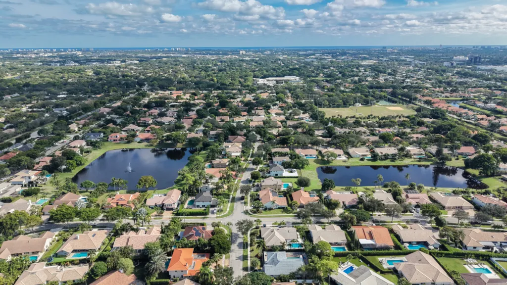 Aerial view of New Floresta in Boca Raton showing neighborhood lakes and surrounding homes