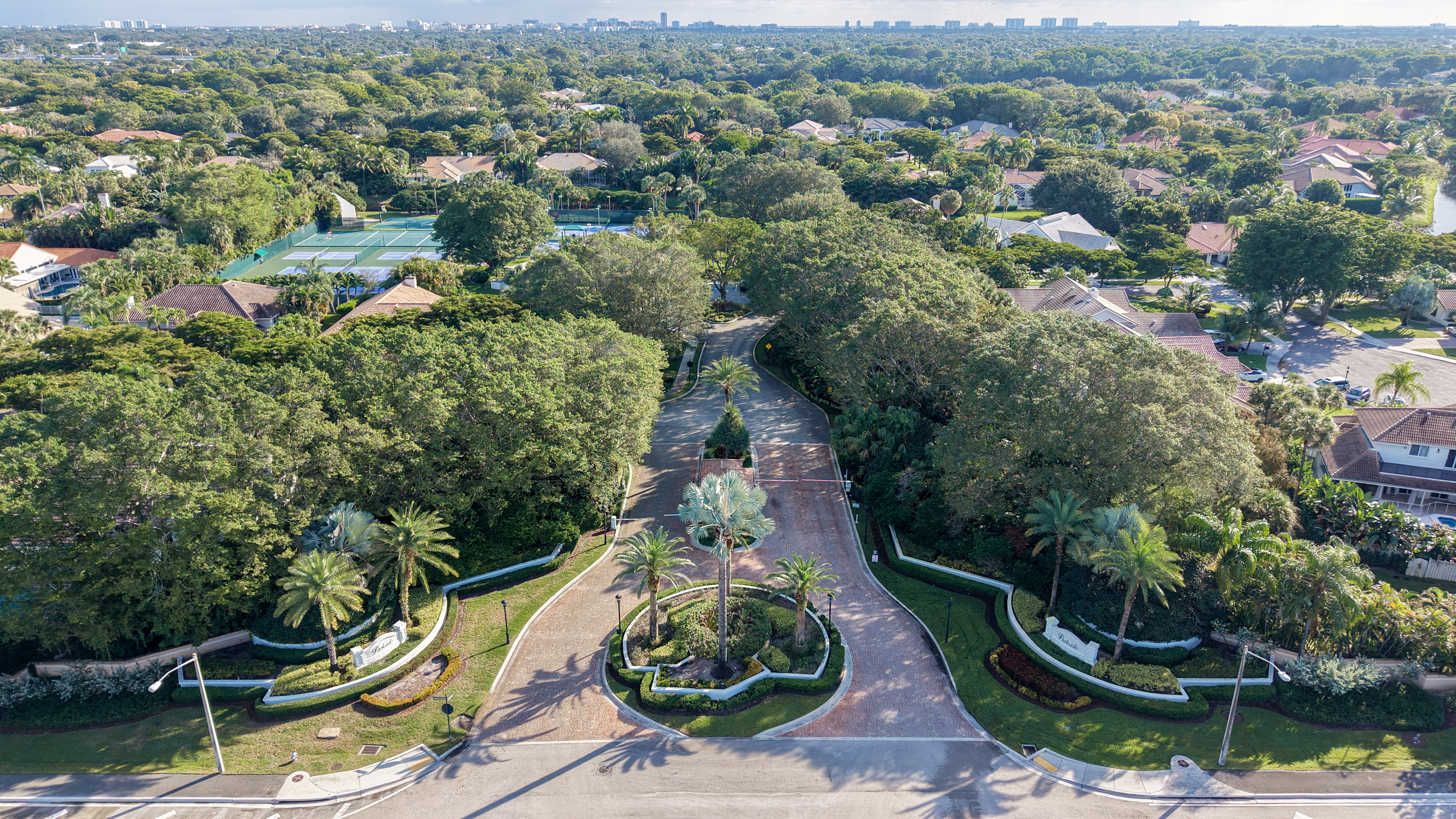 Landscaped entrance boulevard into Parkside gated neighborhood in Boca Raton