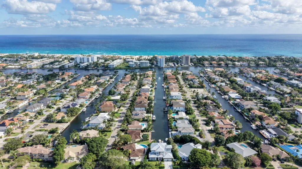 Residential streets with single-family homes in the Tropic Isle neighborhood of Delray Beach, Florida
