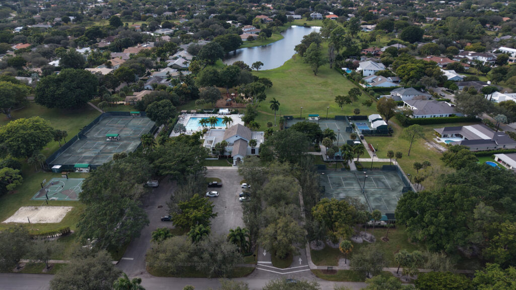 Tennis courts, pool, clubhouse, and sports courts at Boca Bath & Tennis in Boca Raton