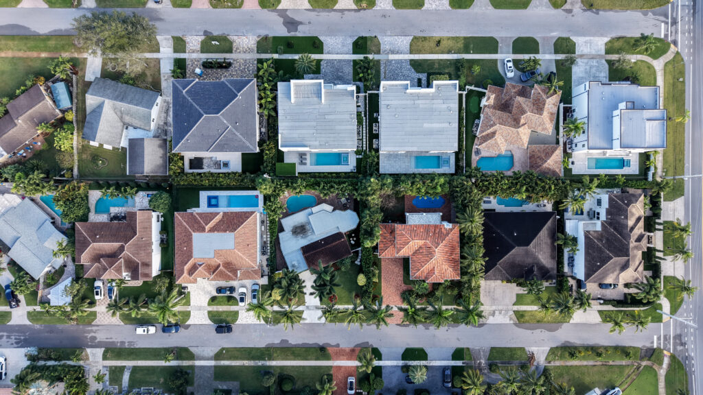 Top-down aerial of single-family homes and pools in the Golden Triangle area of Boca Raton